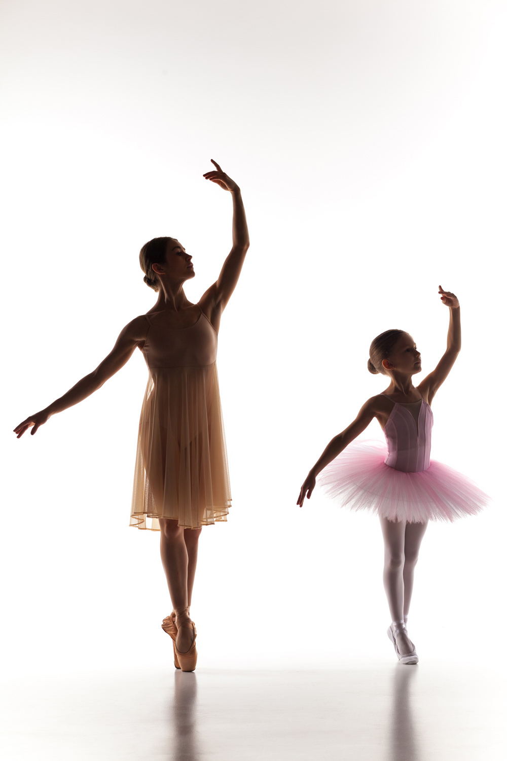 little-ballerina-dancing-with-personal-ballet-teacher-dance-studio